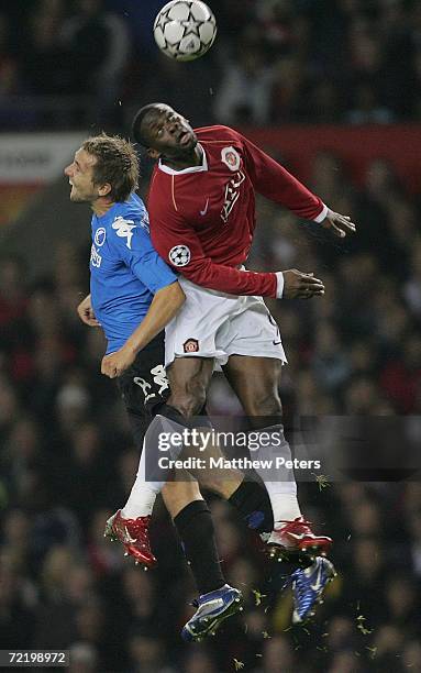 Louis Saha of Manchester United clashes with Michael Silberbauer of FC Copenhagen during the UEFA Champions League match between Manchester United...