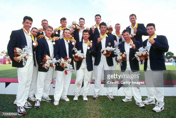 The Australian cricket team celebrate after winning silver during the Mens cricket tournament at the 1998 Commonwealth Games at Kuala Lumpur,...