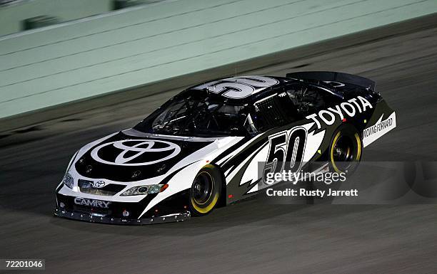 David Reutimann, driver of the Michael Waltrip Racing Toyota, drives during NASCAR Nextel Cup Series testing at Homestead-Miami Speedway on October...