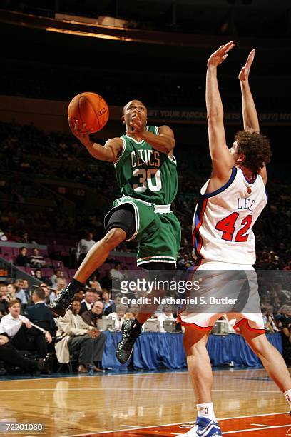 Sebastian Telfair of the Boston Celtics shoots against David Lee of the New York Knicks during their preseason game on October 17, 2006 at Madison...