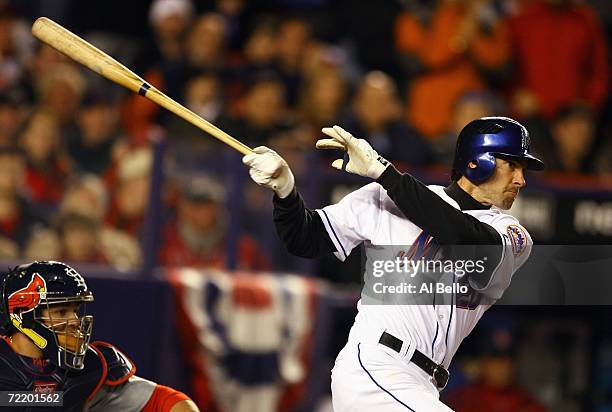 Shawn Green of the New York Mets swings the bat during game two of the NLCS against the St. Louis Cardinals at Shea Stadium on October 13, 2006 in...