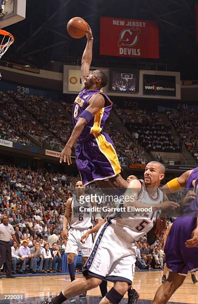 Kobe Bryant of the Los Angeles Lakers dunks against the New Jersey Nets during game four of the 2002 NBA Finals at the Continental Airlines Arena on...