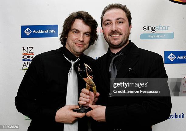 Matt Thomas and James Reid from the band The Feelers pose with their award for Radio Airplay Record of the Year backstage in the Awards Room at The...