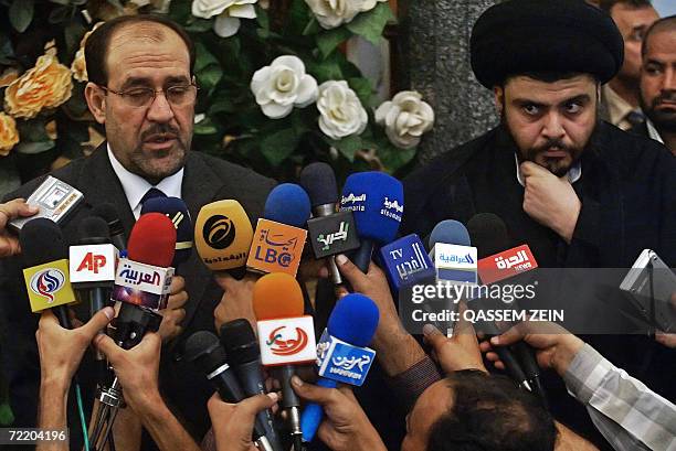 Iraqi Prime Minister Nuri al-Maliki speaks during a joint press conference with Shiite firebrand cleric Moqtada al-Sadr upon their meeting in the...