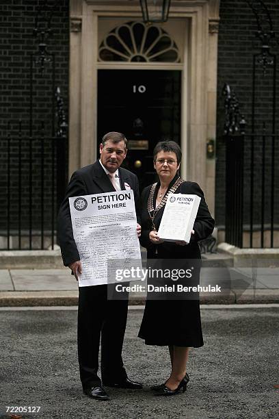 General Secretary of the National Federation of Subpostmasters Colin Baker and President Sally Reeves hold a petition before handing it in to 10...