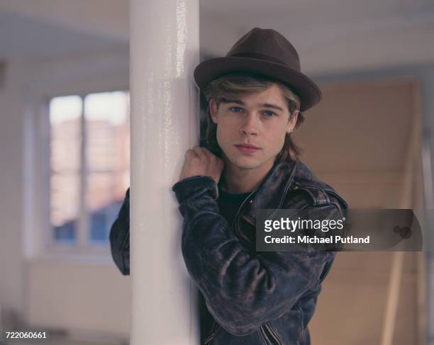 American actor Brad Pitt posed wearing a trilby hat in London in October 1988.