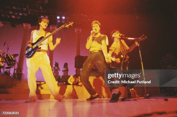From left, bassist John Taylor, singer Simon Le Bon and guitarist Andy Taylor of English new romantic group Duran Duran, perform live on stage circa...
