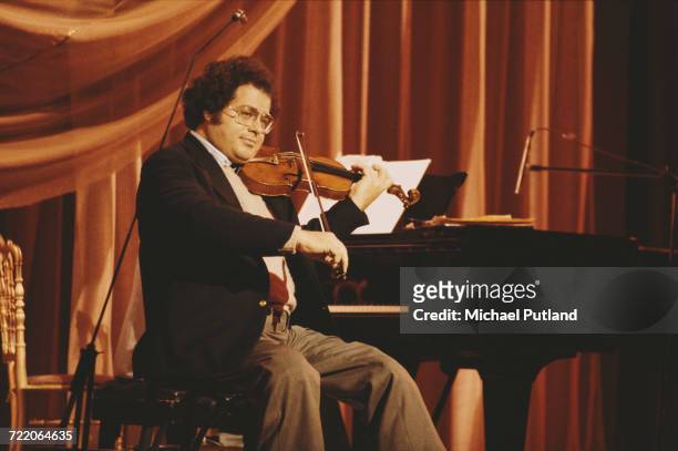 Israeli-American violinist, Itzhak Perlman on stage at the Royal Variety Performance at the Theatre Royal, Drury Lane, London, 17th November 1981.