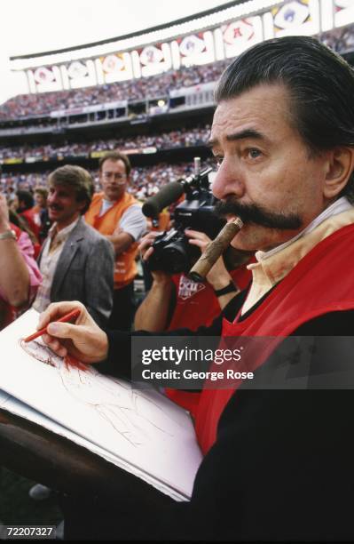 Famed sports artist, LeRoy Neiman, smokes a cigar as he draws sketches during Super Bowl XXII between the Washington Redskins and the Denver Broncos...