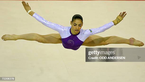 Gymnast Lais Souza of Brasil performs on the floor during the women's team final at the Arena in Aarhus, 18 October 2006 at the 39th Artistic...