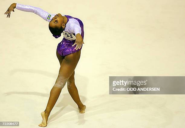 Gymnast Daiane Dos Santos of Brazil performs on the floor during the women's team final at the Arena in Aarhus, 18 October 2006 at the 39th Artistic...