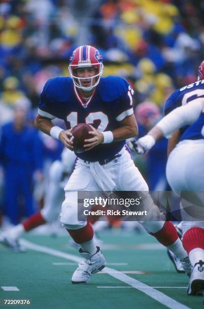 Quarterback Jim Kelly of the Buffalo Bills drops back to pass during a play in the Bills 17-10 victory over the New England Patriots at Rich Stadium...