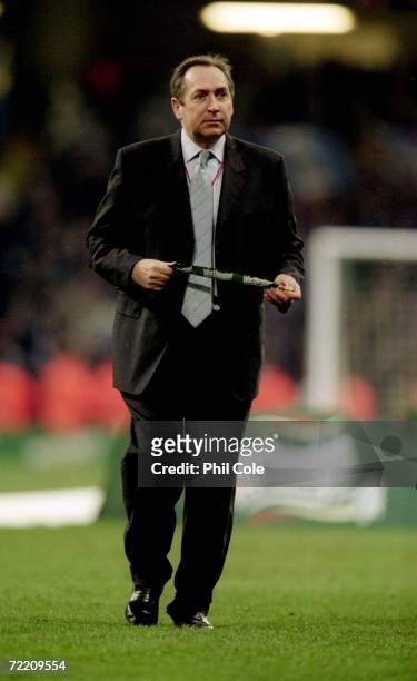 Liverpool manager Gerard Houllier takes a break from the celebrations after the Worthington Cup Final match against Birmingham City played at the...