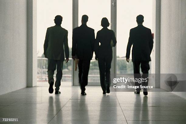 businesspeople walking - businesswoman silhouette stock pictures, royalty-free photos & images