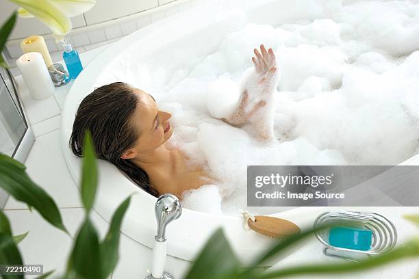 woman in bath - bubblebath stock pictures, royalty-free photos & images