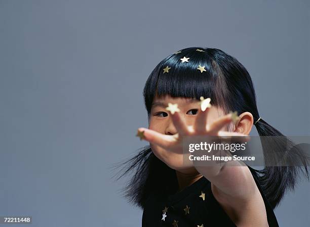 girl covered in gold stars - reach stars stock pictures, royalty-free photos & images