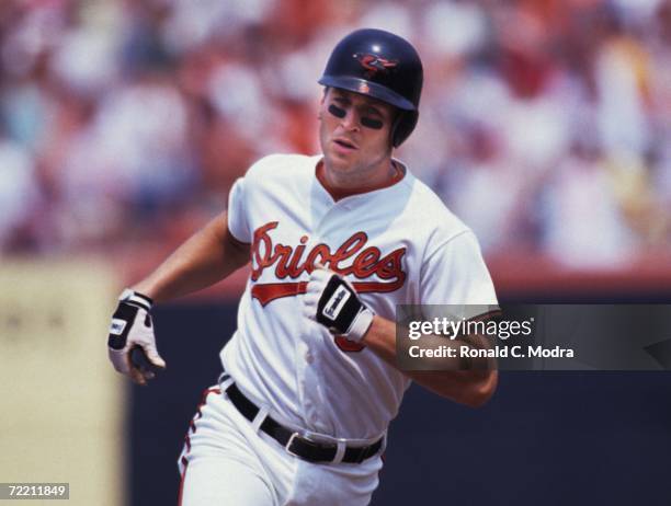 Cal Ripken Jr. #8 of the Baltimore Orioles running to third base in a game against the Seattle Mariners at Memorial Stadium on July 19, 1991 in...