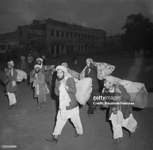 Afghan traders leaving Amritsar, Punjab, with all their belongings, after communal violence in the city during the Partition of British India, March...