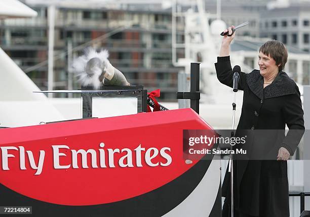 New Zealand Prime Minister Helen Clark cuts the ribbon on the champagne to christen the bow of the new NZL 92 boat during the Team New Zealand...