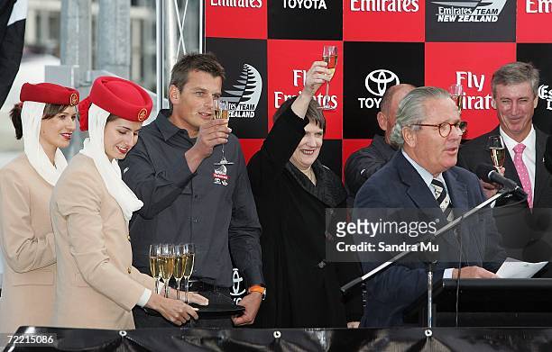Bruno Trouble toasts the new boat as skipper Dean Barker and Prime Minister Helen Clark raise their glasses during the Team New Zealand America's Cup...