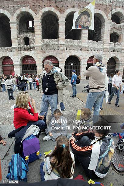 Vatican City, VATICAN CITY STATE: Believers wait for Pope Benedict XVI in front of the Verona Arena, 19 October 2006. Pope Benedict XVI is in the...