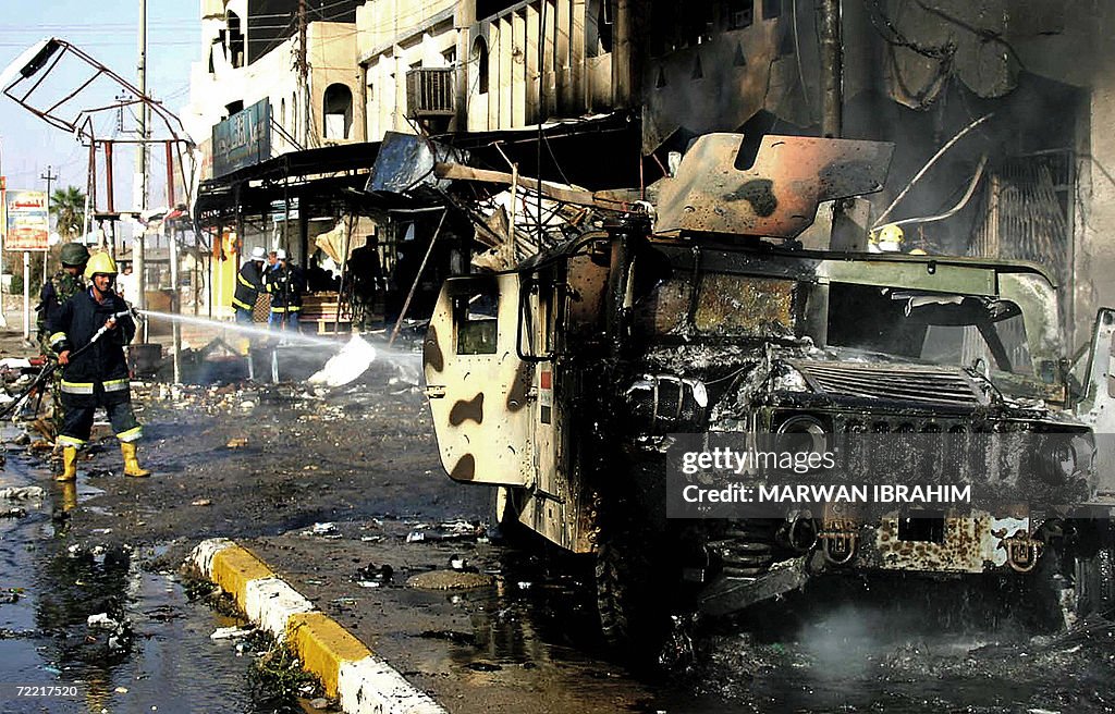 Iraq Fire Engine Iraqi firefighters douse fire that swept over an Iraqi army humvee at ...