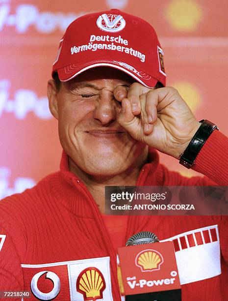 German Ferrari driver Michael Schumacher feigns to cry as he listen questions during a press conference, 19 October 2006, in Sao Paulo, Brazil, three...
