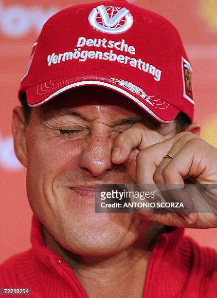 German Ferrari driver Michael Schumacher feigns to cry as he listen questions during a press conference, 19 October 2006, in Sao Paulo, Brazil, three...