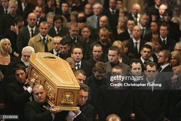 Snooker player Steven Hendry and other players look on as the coffin of snooker star Paul Hunter arrives at Leeds Parish Church during his funeral on...