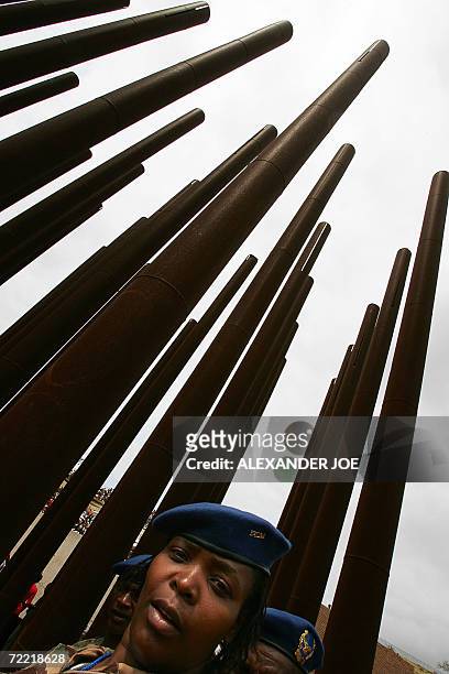 Soldier from Mozambique is pictured 19 October 2006 in Mbuzni at a memorial built on a hill where late President Samora Machel died 20 years ago in a...