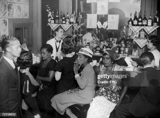 Group of 'entraineuses' in a Paris bar, circa 1925. These women are employed as nightclub hostesses to encourge the customers to buy drinks.