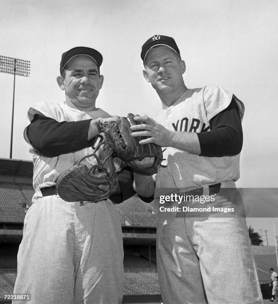 Catcher Yogi Berra and pitcher Whitey Ford of the New York Yankees pose for a portrait prior to Game 1 of the World Series on October 4, 1962 against...