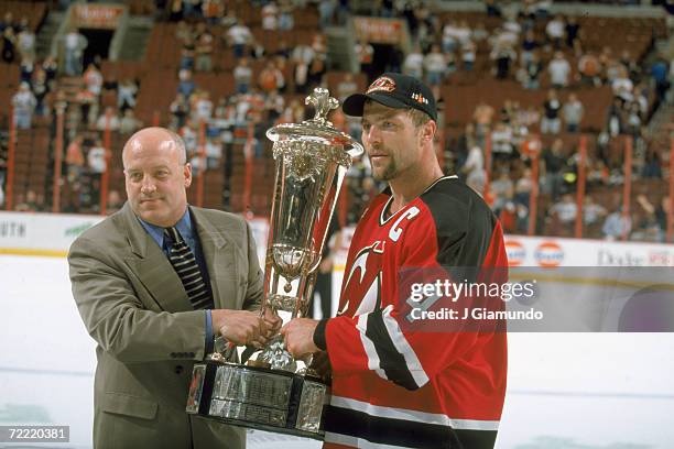 Executive Vice President and Chief Legal Officer Bill Daly presents Canadian professional hockey player Scott Stevens, team captain and defenseman...