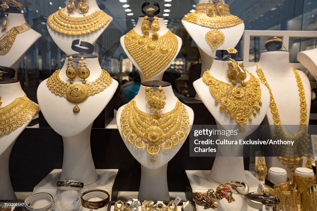Gold necklaces in shop window at the gold souk, Deira, Dubai, United Arab Emirates