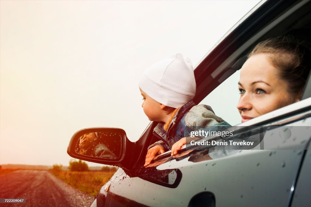Caucasian Mother And Son Looking Out Car Window High-Res Stock Photo