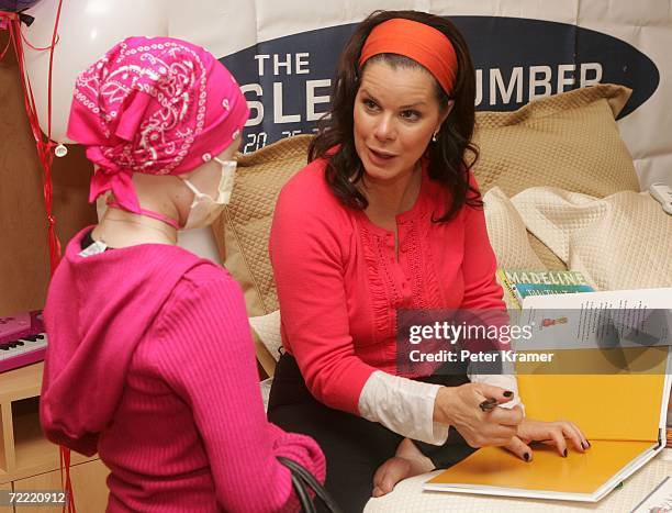 Actress Marcia Gay Harden makes an appearance at The Ronald McDonald House of New York to read books to kids with cancer and to celebrate the...