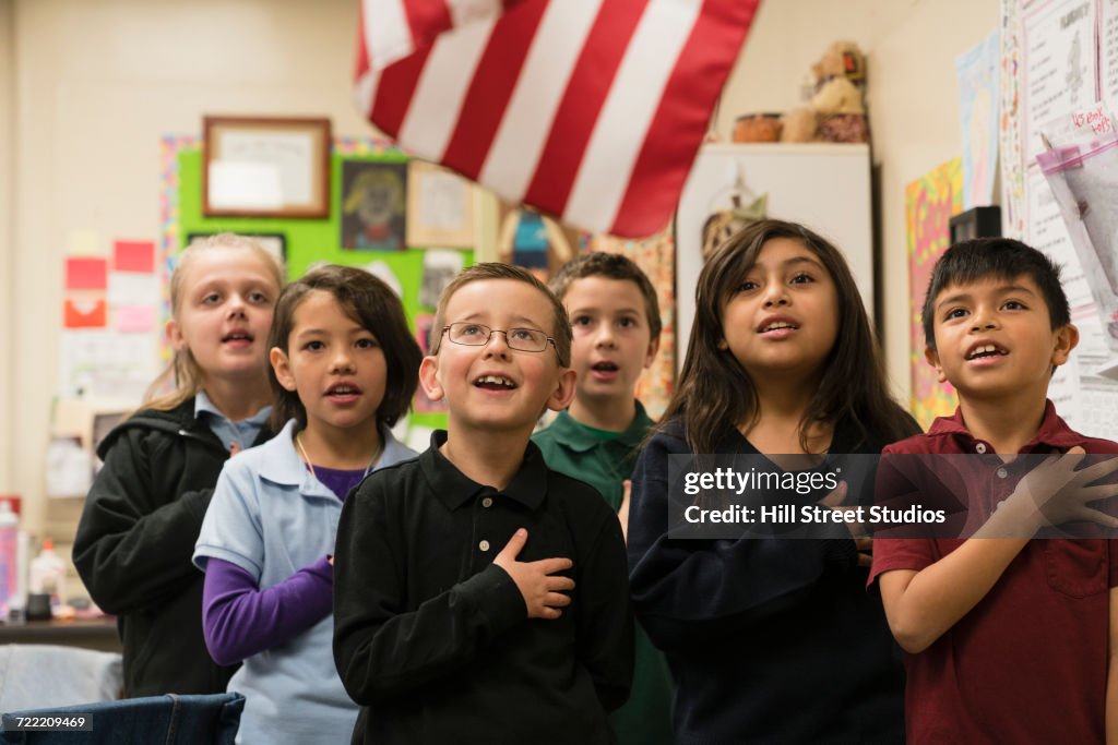 Students standing for Pledge of Allegiance