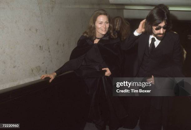 American actress Faye Dunaway and her husband, rock and roll musician Peter Wolf , lead vocalist for the J. Geils Band, walk through a hallway at the...