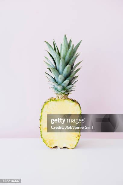 half of sliced pineapple - pineapple cut stock pictures, royalty-free photos & images