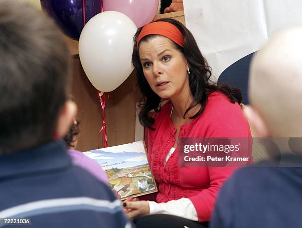 Actress Marcia Gay Harden reads a book to kids at The Ronald McDonald House of New York where they celebrated the auctioning of 25 Sleep Number beds...