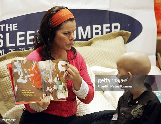 Actress Marcia Gay Harden reads a book to kids at The Ronald McDonald House of New York where they celebrated the auctioning of 25 Sleep Number beds...