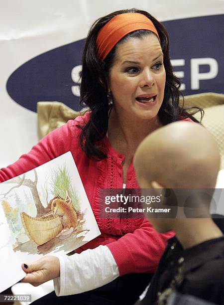 Actress Marcia Gay Harden reads a book to kids at The Ronald McDonald House of New York where they celebrated the auctioning of 25 Sleep Number beds...