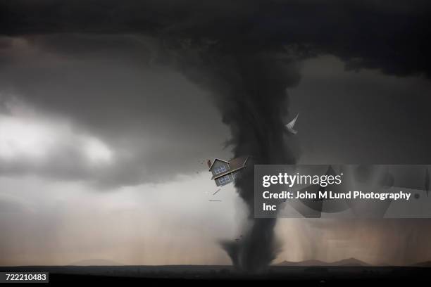 tornado carrying house - tornado stockfoto's en -beelden