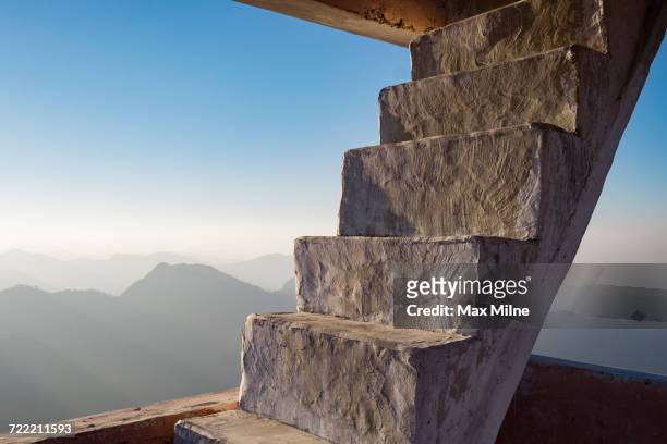 concrete staircase overlooking scenic view of mountains - mussoorie stock pictures, royalty-free photos & images