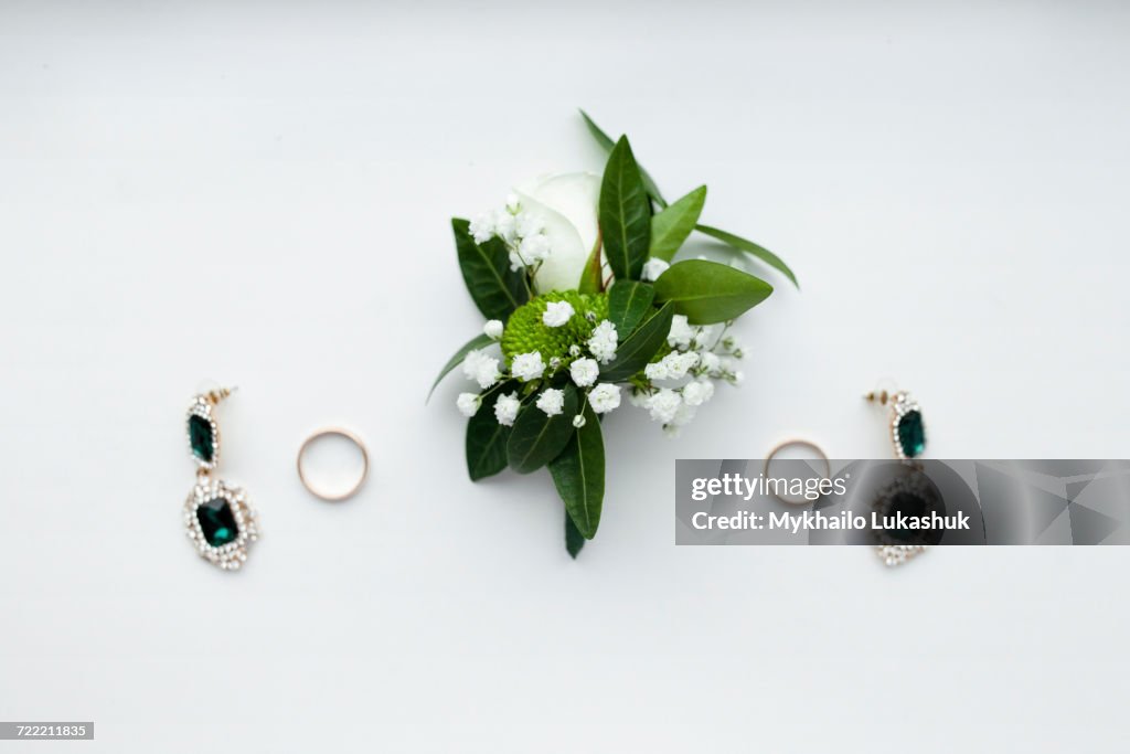 Corsage, earrings and wedding rings