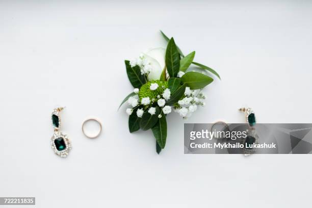 corsage, earrings and wedding rings - corsage imagens e fotografias de stock