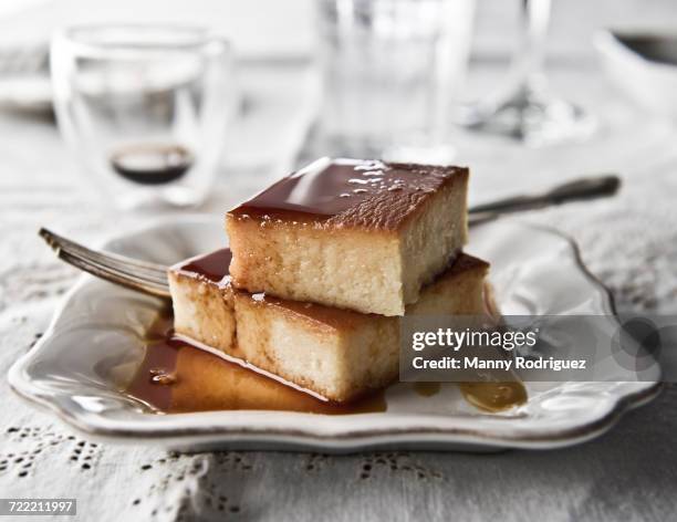 flan on plate with syrup and fork - flan stock pictures, royalty-free photos & images