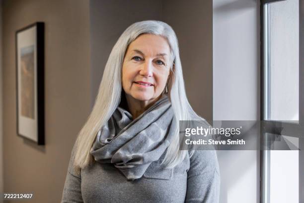 portrait of smiling older caucasian woman - straight hair foto e immagini stock