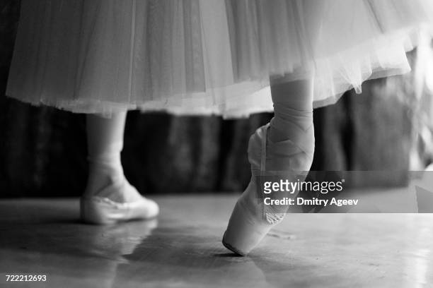 legs of woman stretching in ballet shoes - ballet dancers russia stock pictures, royalty-free photos & images