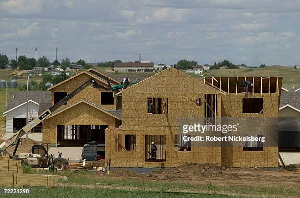 Carpenter crews finish a split level home in a new housing subdivision on June 15, 2006 in Gillette, Wyoming. The city of Gillette, part of Campbell...
